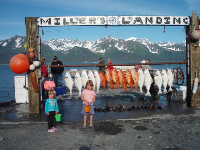 The kids were very interested in the fish that had been caught.